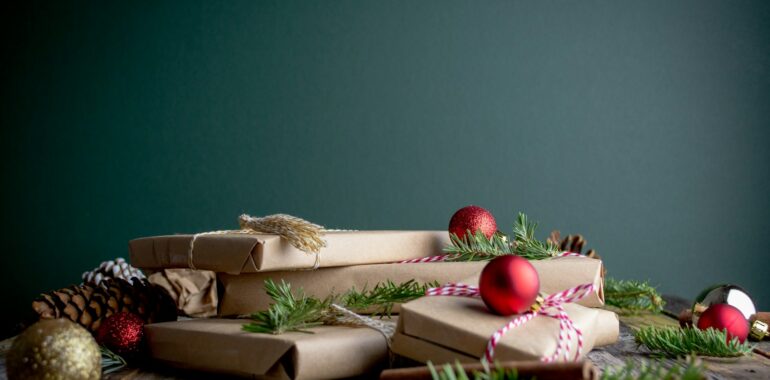 gift boxes with red baubles on top