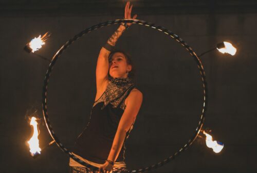 woman fire dancing at night