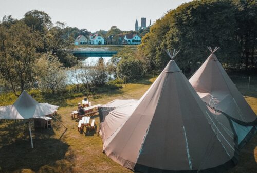 a group of tents sitting next to a river